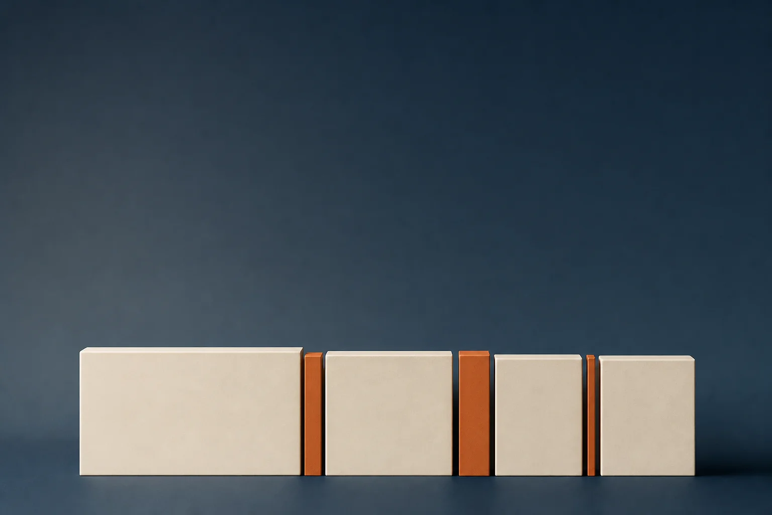 Four blank ivory blocks of unequal width in a single row on a midnight navy surface, separated by copper bars of differing thickness